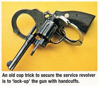 police lock up trick with revolver and handcuffs